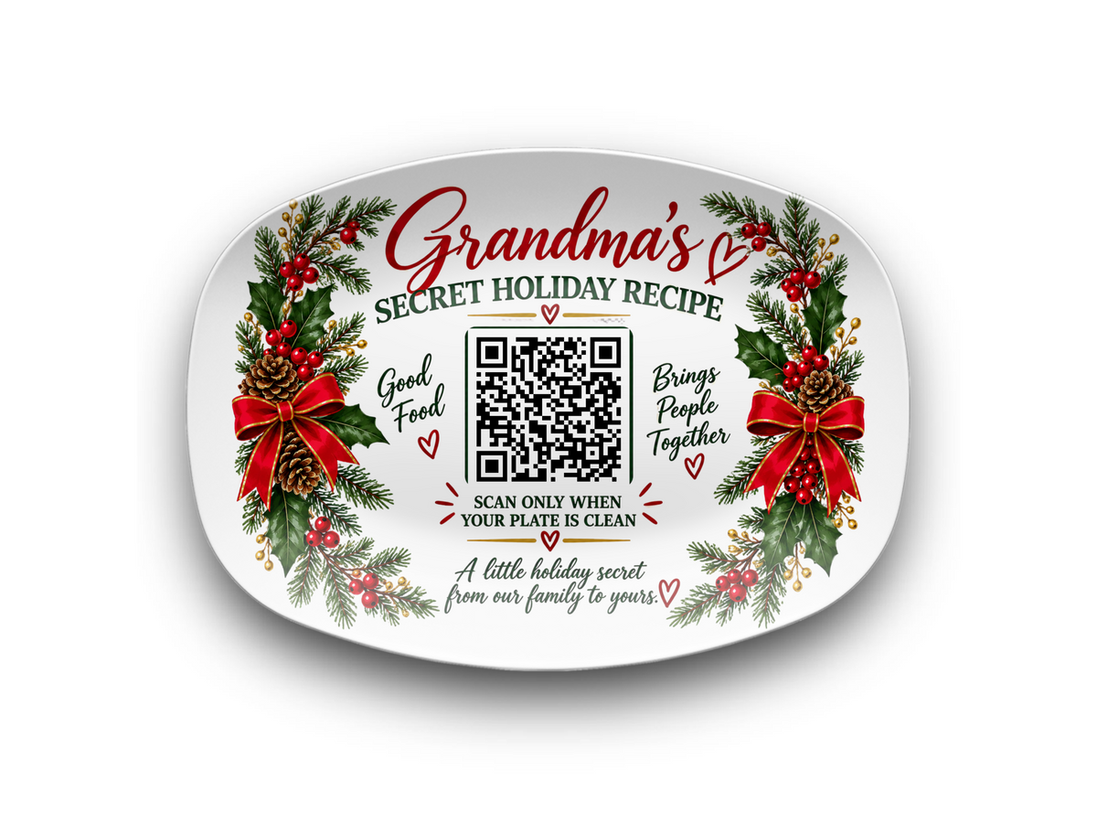 A white ceramic holiday plate with a festive Christmas design, featuring red bows, green holly leaves, pinecones, and red berries. The center of the plate has a QR code surrounded by text that reads 'Grandma's SECRET HOLIDAY RECIPE' and 'Brings People Together'.
