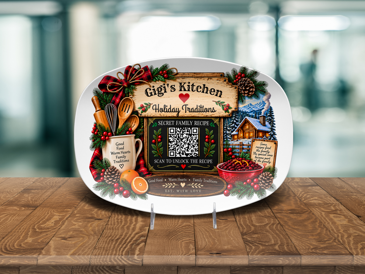 A white oval decorative serving platter displayed on a wooden table, featuring a festive Christmas-themed printed design with the text 'Gigi's Kitchen' and 'Holiday Traditions,' a scanable  QR code, holiday illustrations, and small clear display stands supporting the platter.